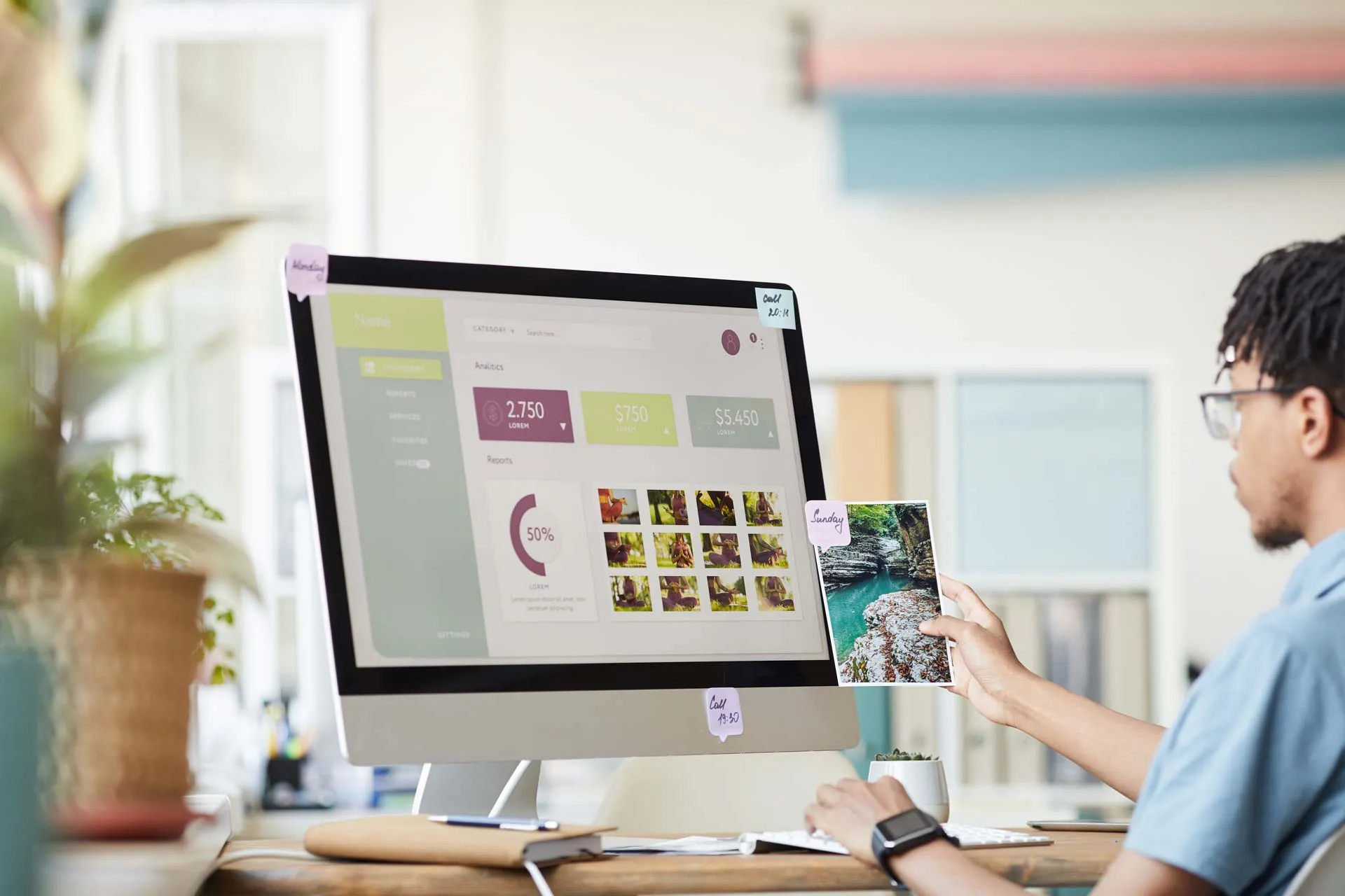 man-reviews-photography-on-computer-screen-at-desk-2026-03-19-21-46-19-utc How Our Custom Web Designs Can Elevate Your Brand