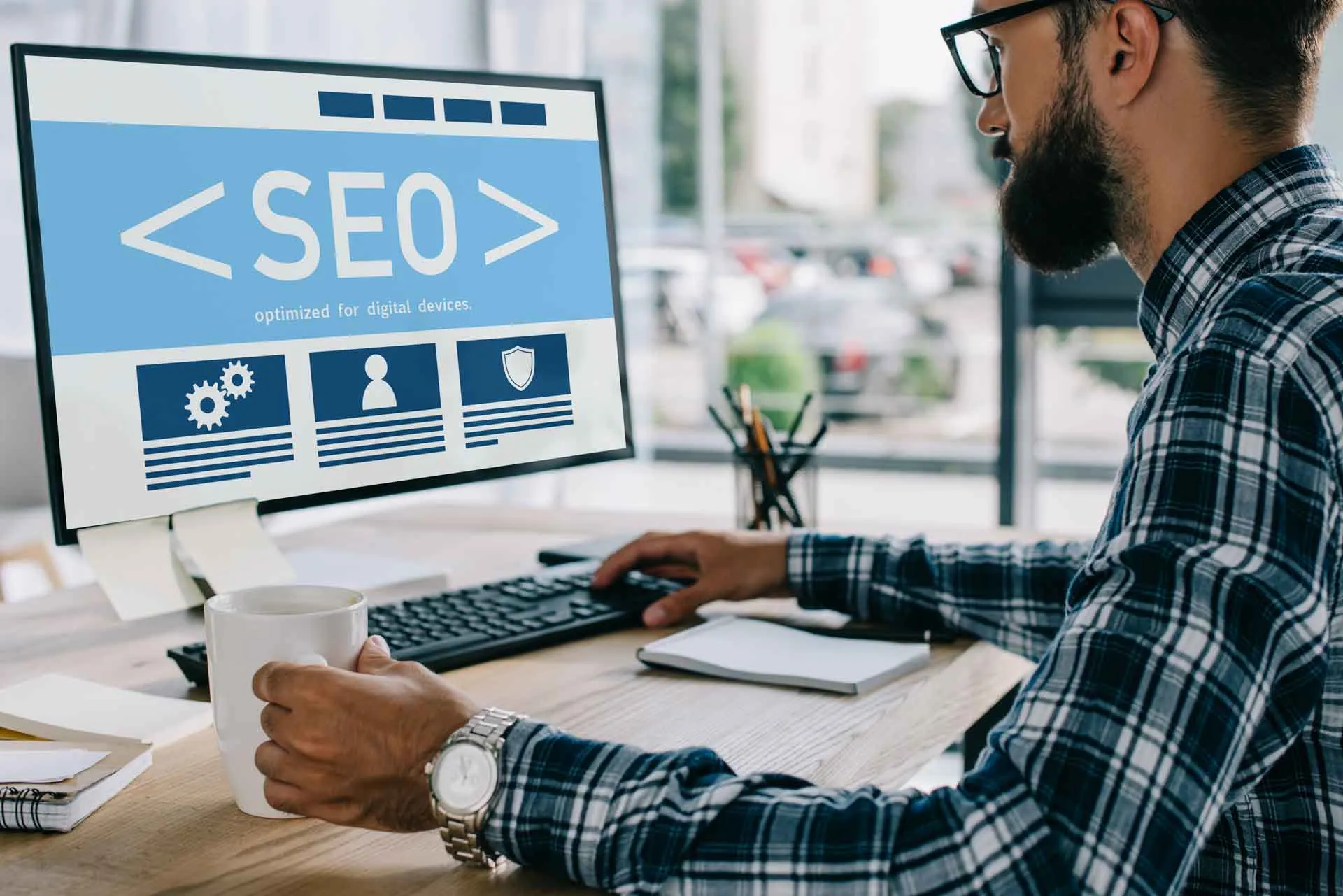 man-working-on-seo-at-desk-with-coffee-2026-01-06-00-43-26-utc How to Improve Your Local Search Rankings: Effectively Focused Strategies for Miami Local Businesses